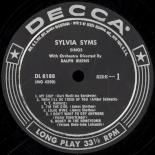 Syms_Sings_Label_1.jpg